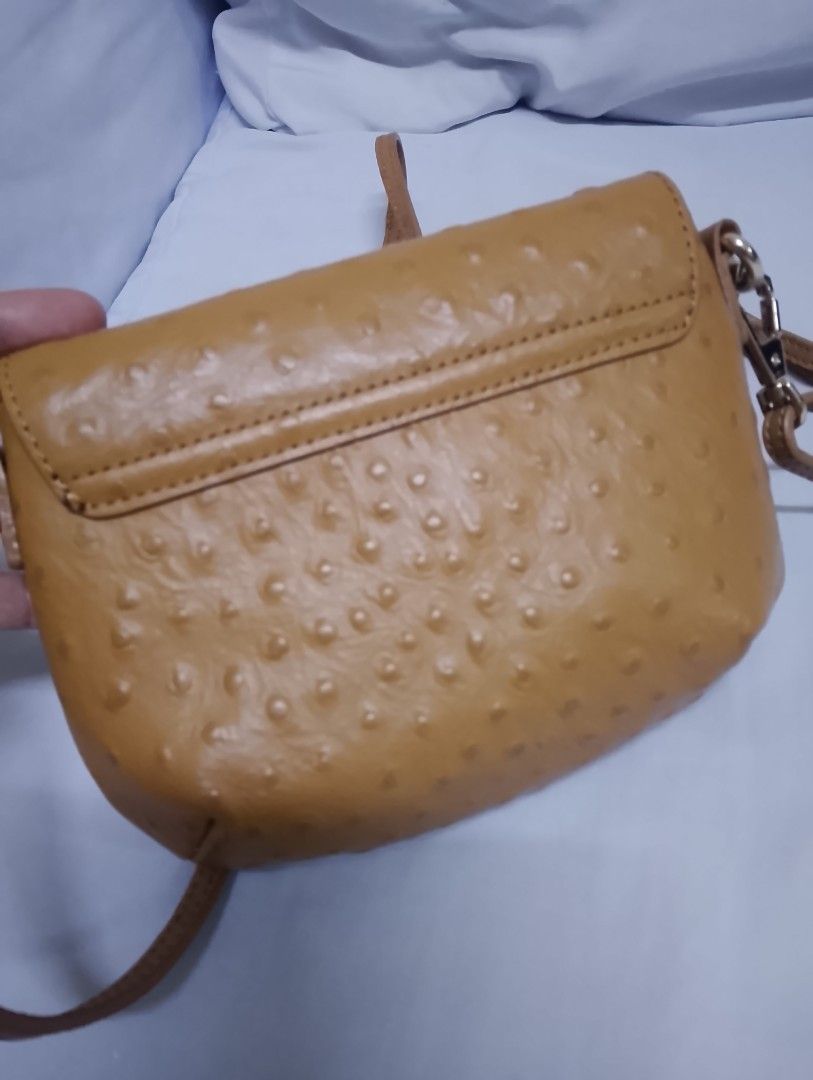 DKNY mini sling bag (Category: Cross-body Bags) located in Quezon City. Submitted by isabelle_1212_ (Listing ID 1469851456, Image 3). Description: like new no flaws with dustbag.