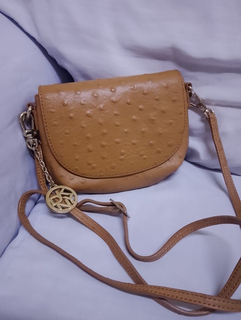 DKNY mini sling bag (Category: Cross-body Bags) located in Quezon City. Submitted by isabelle_1212_ (Listing ID 1469851456, Image 2). Description: like new no flaws with dustbag.