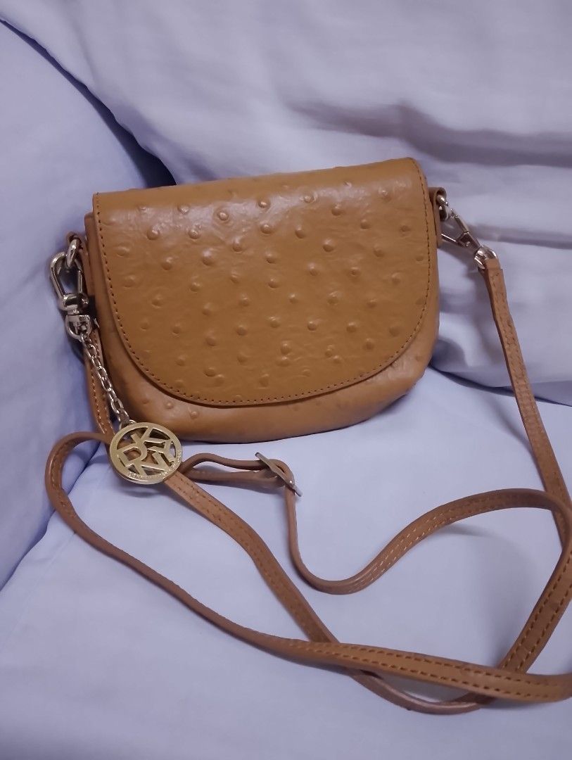 DKNY mini sling bag (Category: Cross-body Bags) located in Quezon City. Submitted by isabelle_1212_ (Listing ID 1469851456, Image 1). Description: like new no flaws with dustbag.