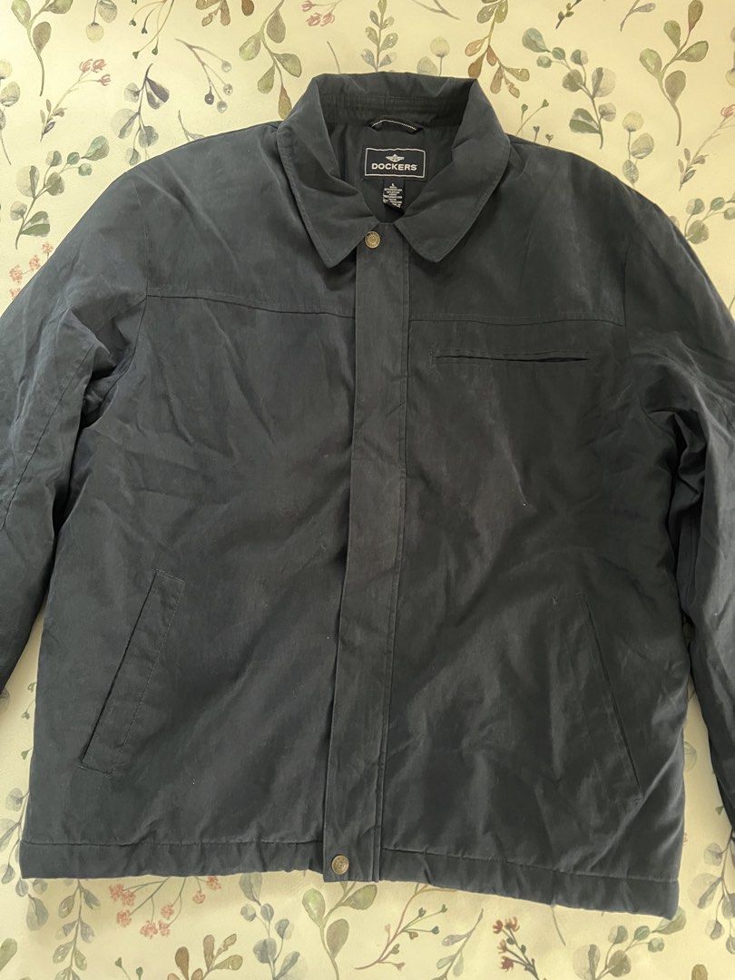 Dockers Black Jacket Size L (Category: Coats, Jackets and Outerwear) located in Muntinlupa City. Submitted by 09leah77 (Listing ID 1469789141, Image 1). Description: - Brand: Dockers - Size: Large - Color: Classic Black - Material: Durable polyester-nylon blend shell with cozy polyester lining and filler - Closure: Secure zip-up front with snap button placket and stylish collar - Pockets: Convenient front pockets and one chest pocket - Fit: Stand
