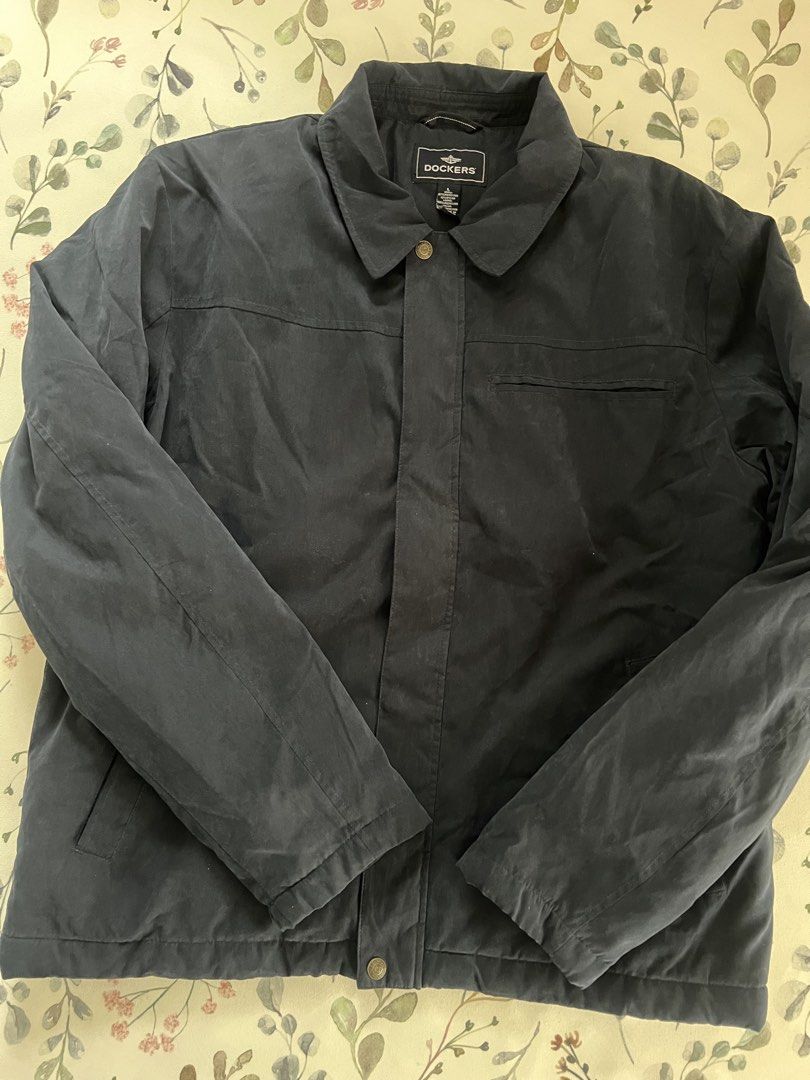 Dockers Black Jacket Size L (Category: Coats, Jackets and Outerwear) located in Muntinlupa City. Submitted by 09leah77 (Listing ID 1469789141, Image 2). Description: - Brand: Dockers - Size: Large - Color: Classic Black - Material: Durable polyester-nylon blend shell with cozy polyester lining and filler - Closure: Secure zip-up front with snap button placket and stylish collar - Pockets: Convenient front pockets and one chest pocket - Fit: Stand