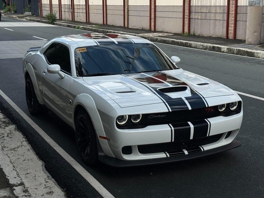 Dodge Challenger R/T Scat Pack Widebody Auto (Category: Used Cars) located in Manila. Submitted by quality_cars (Listing ID 1469922049, Image 2). Description: FOR SALE / FINANCING ❗️ 🇺🇸 2023 Dodge Challenger R/T Scat Pack Widebody ⭐ FEATURES • 6.4L / 392 HEMI V8 • 485 HP • 644 Nm Torque • 8-Speed Automatic Transmission • Widebody Fender Flares • Brembo Performance Brakes • Sport / Track Modes • Launch Control • Performance Suspension • Premium 