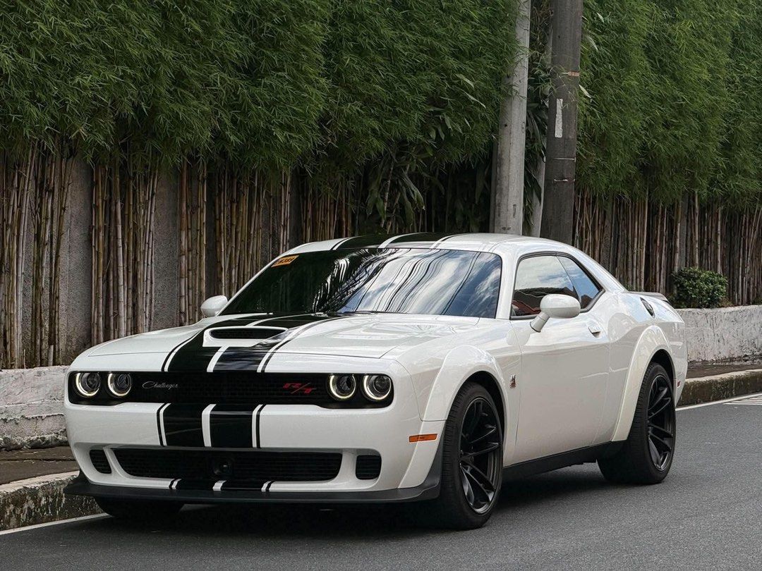 Dodge Challenger R/T Scat Pack Widebody Auto (Category: Used Cars) located in Manila. Submitted by quality_cars (Listing ID 1469922049, Image 1). Description: FOR SALE / FINANCING ❗️ 🇺🇸 2023 Dodge Challenger R/T Scat Pack Widebody ⭐ FEATURES • 6.4L / 392 HEMI V8 • 485 HP • 644 Nm Torque • 8-Speed Automatic Transmission • Widebody Fender Flares • Brembo Performance Brakes • Sport / Track Modes • Launch Control • Performance Suspension • Premium 
