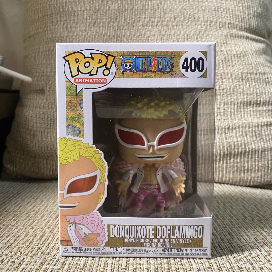 Donquixote Doflamingo Funko Pop (Category: Designer & Blind Box Toys) located in Paranaque City. Submitted by ddaveduave01162 (Listing ID 1469901027, Image 1). Description: - Character: Donquixote Doflamingo from One Piece (#400) - Brand: Funko Pop! Animation Vinyl Figure - Details: Features his iconic pink feathered coat, blonde hair, and red sunglasses - Packaging: Original window box included, box flaps and corners are all intact - Condition: 