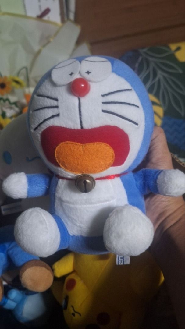 Doraemon – Star Eyes Metal Bell Plush (Category: Plushies & Soft Toys) located in Paombong. Submitted by revox.store (Listing ID 1469901967, Image 1). Description: Doraemon • Plush Included: ✓ Doraemon plush with star-sparkle eyes, plastic nose, and metal bell ✓ Official Doraemon fabric tush tag attached Flaws: • Minor surface patina and tarnish on metal bell 📍 On-hand (Paombong, Bulacan) 🚚 Ships nationwide, dispatched within 3–5 days after pay