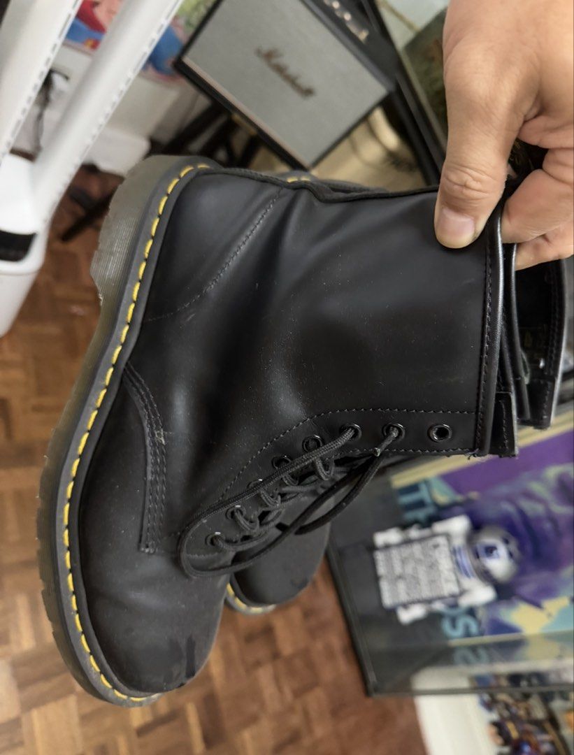 Dr. Martens 1460 Black Leather Boots size 12 (Category: Boots) located in Marikina City. Submitted by rexie5 (Listing ID 1469813097, Image 1). Description: - Brand: Dr. Martens - Style: Classic 8-eyelet lace-up boots - Color: Black - Features: Signature yellow welt stitching, translucent air-cushioned rubber soles with great grip - Condition: Natural creasing on uppers and slight scuffs on the toe area from regular wear - Durability: Sturdy build