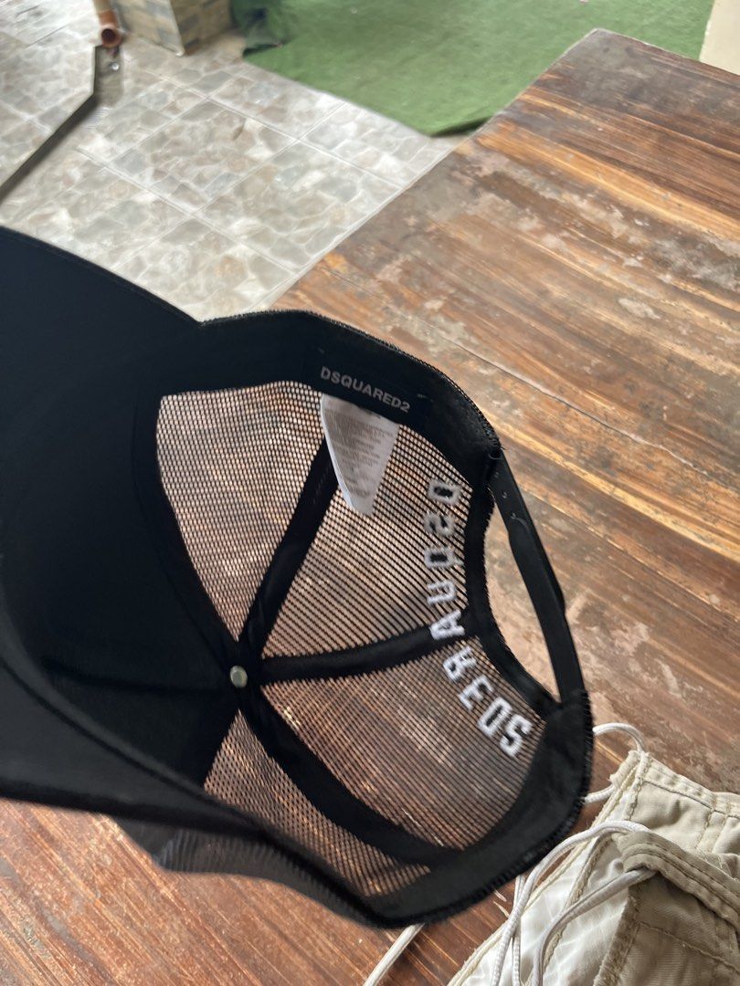 Dsquared2 'Bitch Where' Trucker Cap Black (Category: Caps & Hats) located in Quezon City. Submitted by reluxefinds2025 (Listing ID 1469806098, Image 3). Description: - Authentic Black Dsquared2 trucker hat with all interior tags and branding intact - Features bold raised 'BITCH WHERE' text on the front and white embroidery on the back - Designed with breathable mesh back panels for all-day comfort - Equipped with an adjustable snapback closure fo