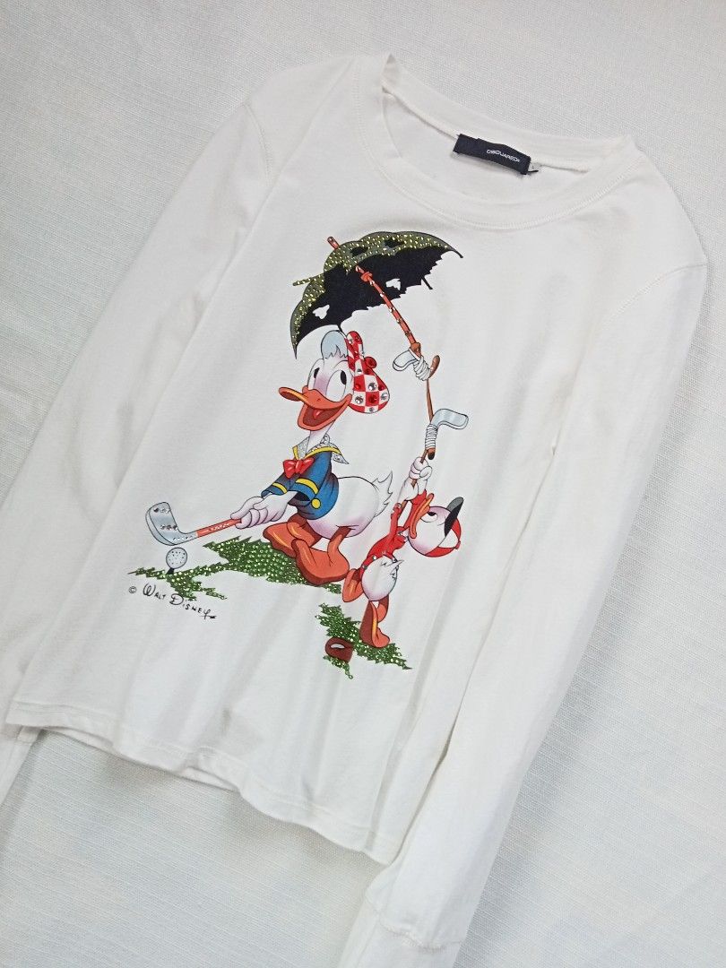 DSQUARED2 walt disney donald duck longsleeve top (Category: Longsleeves) located in Bagabag. Submitted by thrift_stories96 (Listing ID 1469930749, Image 2). Description: DSQUARED2 walt disney donald duck longsleeve top Large on tag fits medium Length - 22 Width - 16.5 stretch up to 18 Condition - 9/10 Flaw - tiny fade yellow stain on some parts,not noticeable. Needs more wash.