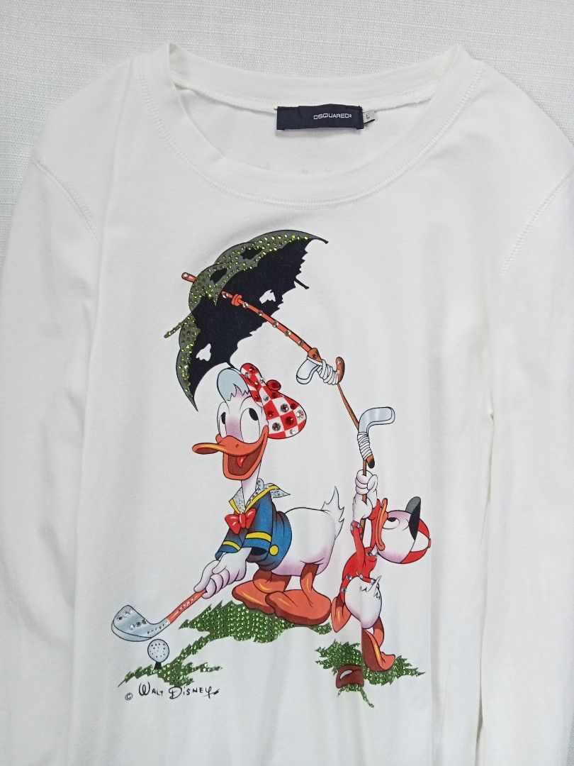 DSQUARED2 walt disney donald duck longsleeve top (Category: Longsleeves) located in Bagabag. Submitted by thrift_stories96 (Listing ID 1469930749, Image 3). Description: DSQUARED2 walt disney donald duck longsleeve top Large on tag fits medium Length - 22 Width - 16.5 stretch up to 18 Condition - 9/10 Flaw - tiny fade yellow stain on some parts,not noticeable. Needs more wash.