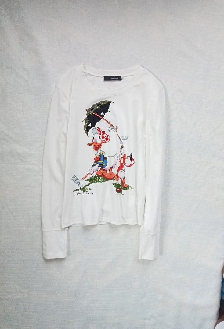 DSQUARED2 walt disney donald duck longsleeve top (Category: Longsleeves) located in Bagabag. Submitted by thrift_stories96 (Listing ID 1469930749, Image 1). Description: DSQUARED2 walt disney donald duck longsleeve top Large on tag fits medium Length - 22 Width - 16.5 stretch up to 18 Condition - 9/10 Flaw - tiny fade yellow stain on some parts,not noticeable. Needs more wash.