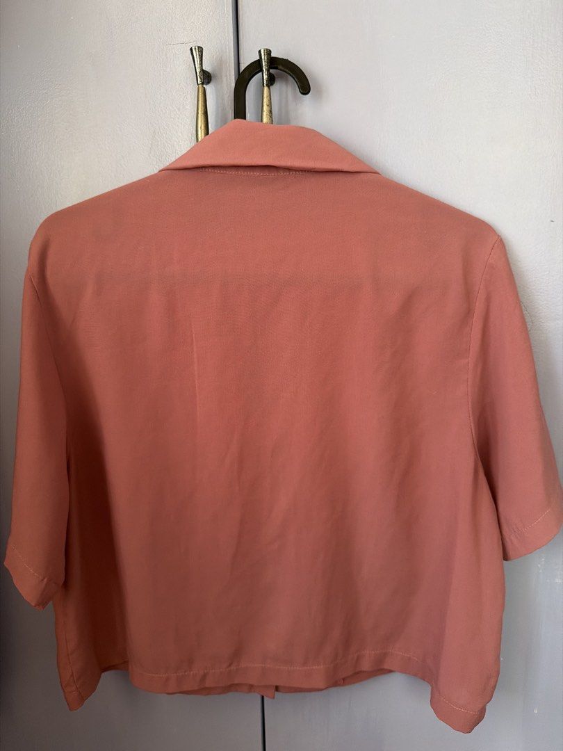 Dusty Pink Short Sleeve Button Down Cropped Blouse (Category: Blouses) located in Lipa City. Submitted by sheenamayyy (Listing ID 1469839116, Image 2). Description: Cropped Short-Sleeve Polo – Dusty Rose (Old Rose) Selling Price: ₱120 only! 🌸 Cute and versatile cropped polo in a lovely dusty rose shade. Easy to pair with high-waisted jeans, shorts, or trousers. • Brand: No brand • Color: Dusty Rose (Old Rose) • Size: Fits S–M frames • Style: Cro