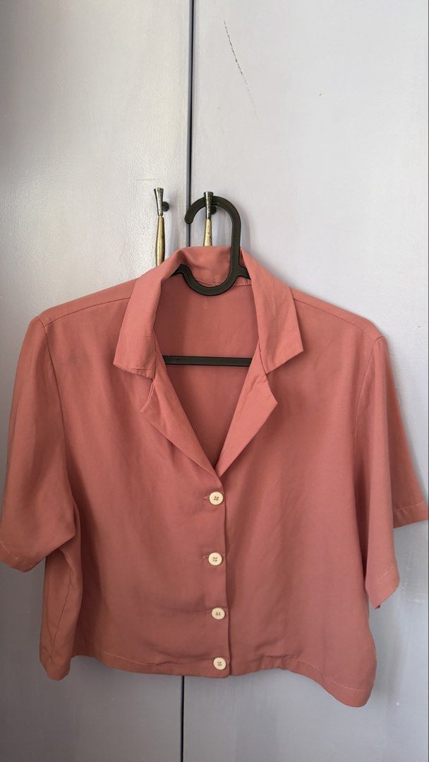 Dusty Pink Short Sleeve Button Down Cropped Blouse (Category: Blouses) located in Lipa City. Submitted by sheenamayyy (Listing ID 1469839116, Image 1). Description: Cropped Short-Sleeve Polo – Dusty Rose (Old Rose) Selling Price: ₱120 only! 🌸 Cute and versatile cropped polo in a lovely dusty rose shade. Easy to pair with high-waisted jeans, shorts, or trousers. • Brand: No brand • Color: Dusty Rose (Old Rose) • Size: Fits S–M frames • Style: Cro