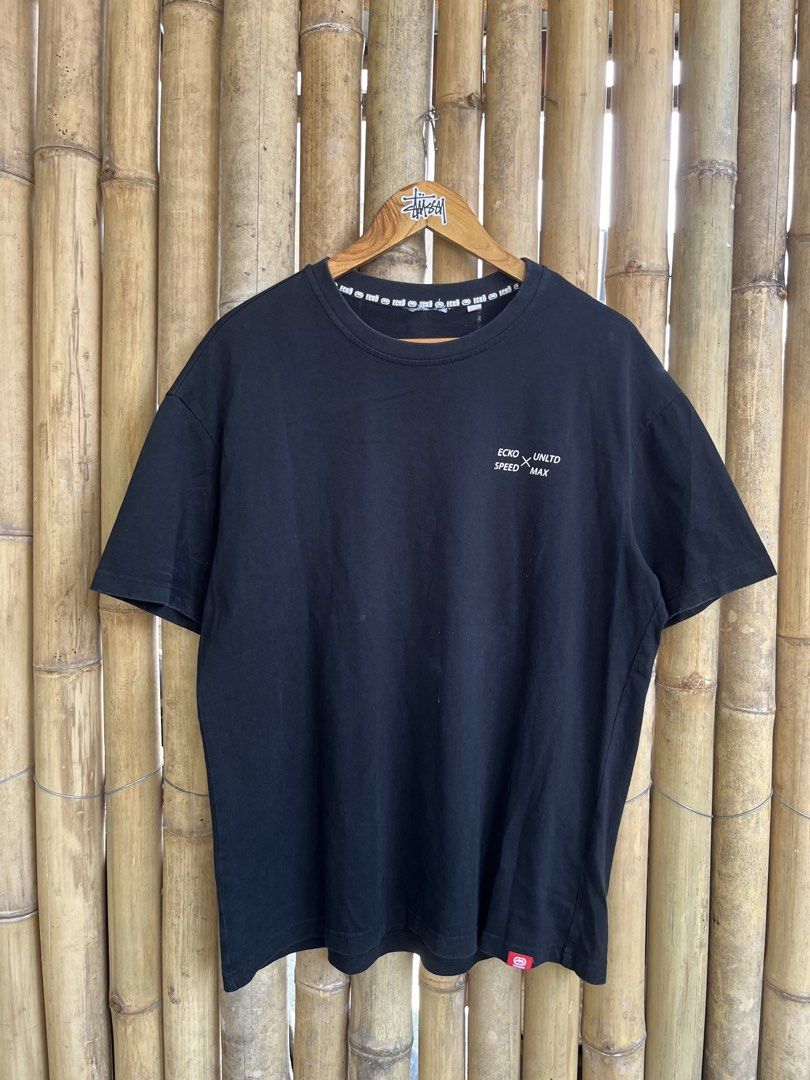 Ecko Unltd Racing Black T-Shirt Size L (Category: Tshirts & Polo Shirts ) located in Manila. Submitted by thrifttika (Listing ID 1469828811, Image 2). Description: - Brand/Model: Ecko Unltd Racing Black T-Shirt - Size: L (fits true to size) - Material: Soft and comfortable cotton - Design: Small white chest logo and bold race track graphic on the back - Details: Branded neck tape and iconic red rhino tag on the bottom hem - Style: Perfect additio