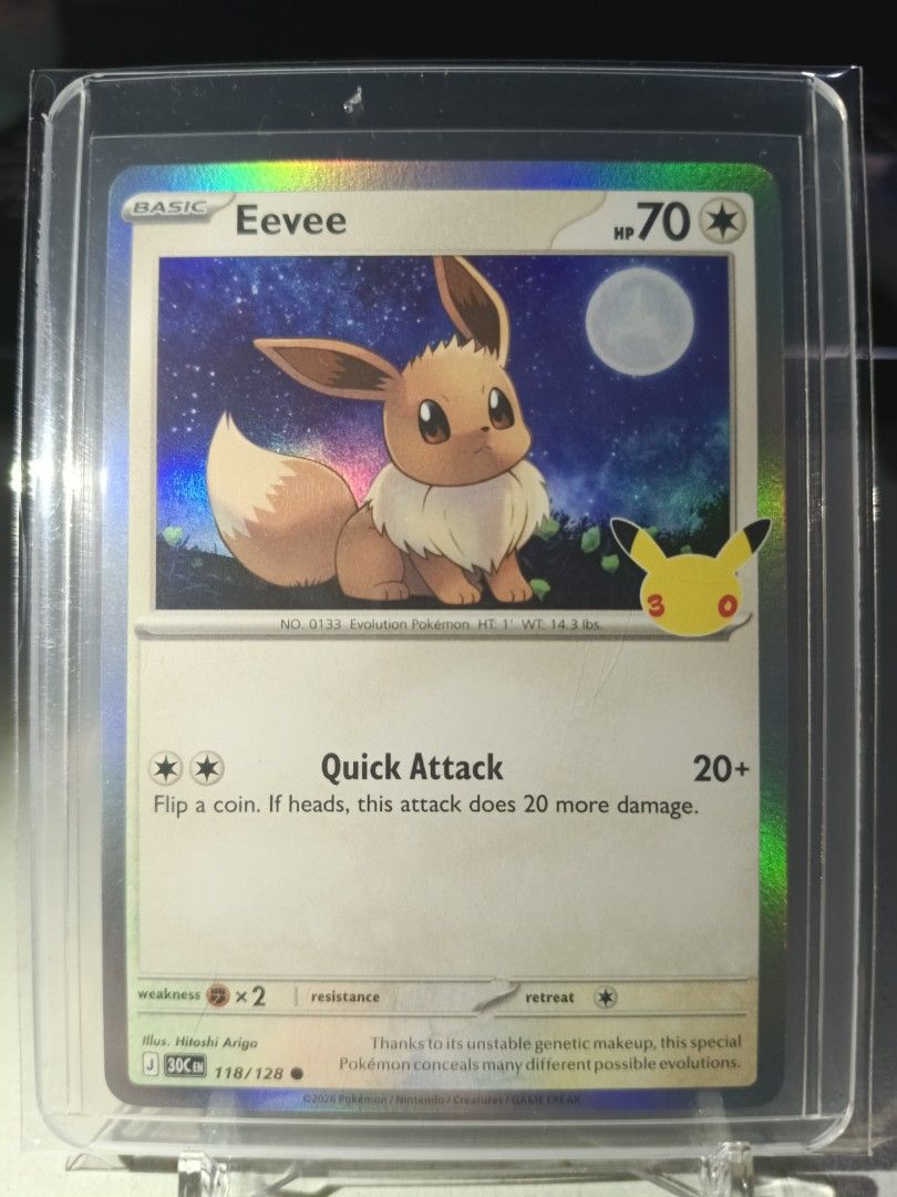 Eevee 118/128 Common (Category: Raw Singles) located in General Trias. Submitted by hobbyshare19 (Listing ID 1469825112, Image 1). Description: WTS (Want to Sell) • Character Name: Eevee (with Pikachu 30th Celebration stamp) • Card Code: 118/128 • Rarity: Common (C) / Holo • Set: 30th Celebration Expansion Set • Condition: Near Mint (Kept in OPP plastic + toploader + toploader sleeve) • Price: ₱50 • Location: General Trias, Cavite • Transaction: 
