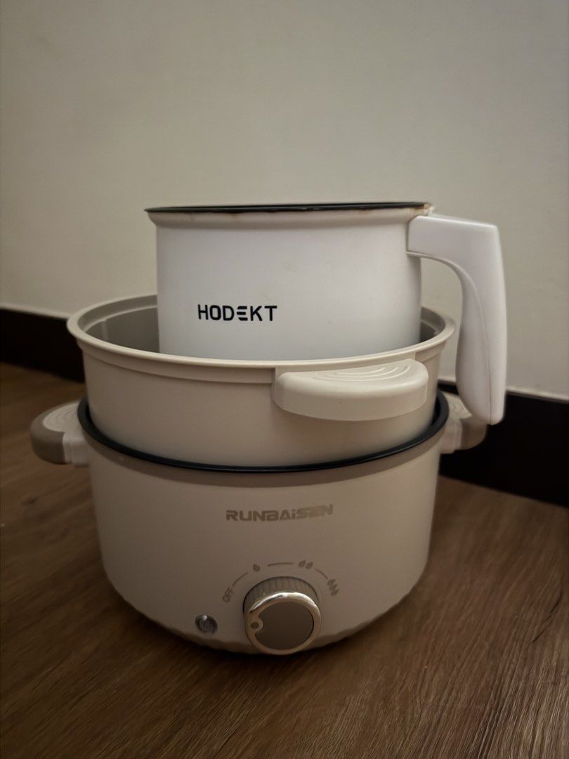Electric cooker. TAKE ALL (Category: Cookers) located in Bulacan. Submitted by chewieeee_ (Listing ID 1469931550, Image 1). Description: 5L capacity electric cooker with 2 layers, plus an extra HODEKT pot included. Non-stick coating inside pots, shows some minor wear and stains from previous cooking use but all still works perfectly fine. RFS: bought induction cooker Original lids included. No wire included. .