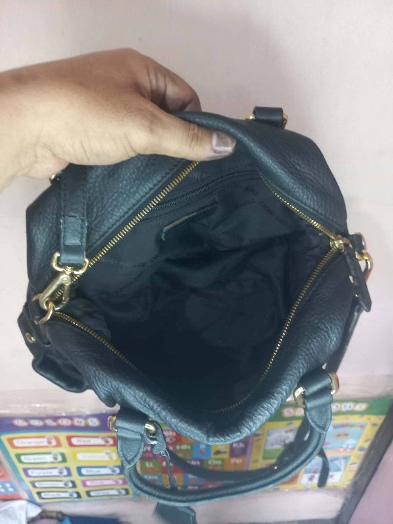 Emini House black leather handbag with strap (Category: Luxury Bags & Wallets) located in Manila. Submitted by dei03_diz (Listing ID 1469778683, Image 3). Description: - Brand: Emini House - Color & Material: Black textured leather with gold-tone hardware - Closure: Secure zip-top closure - Carrying Options: Double top handles and an adjustable, detachable shoulder strap - Interior: Signature branded fabric lining with a convenient zip pocket - D
