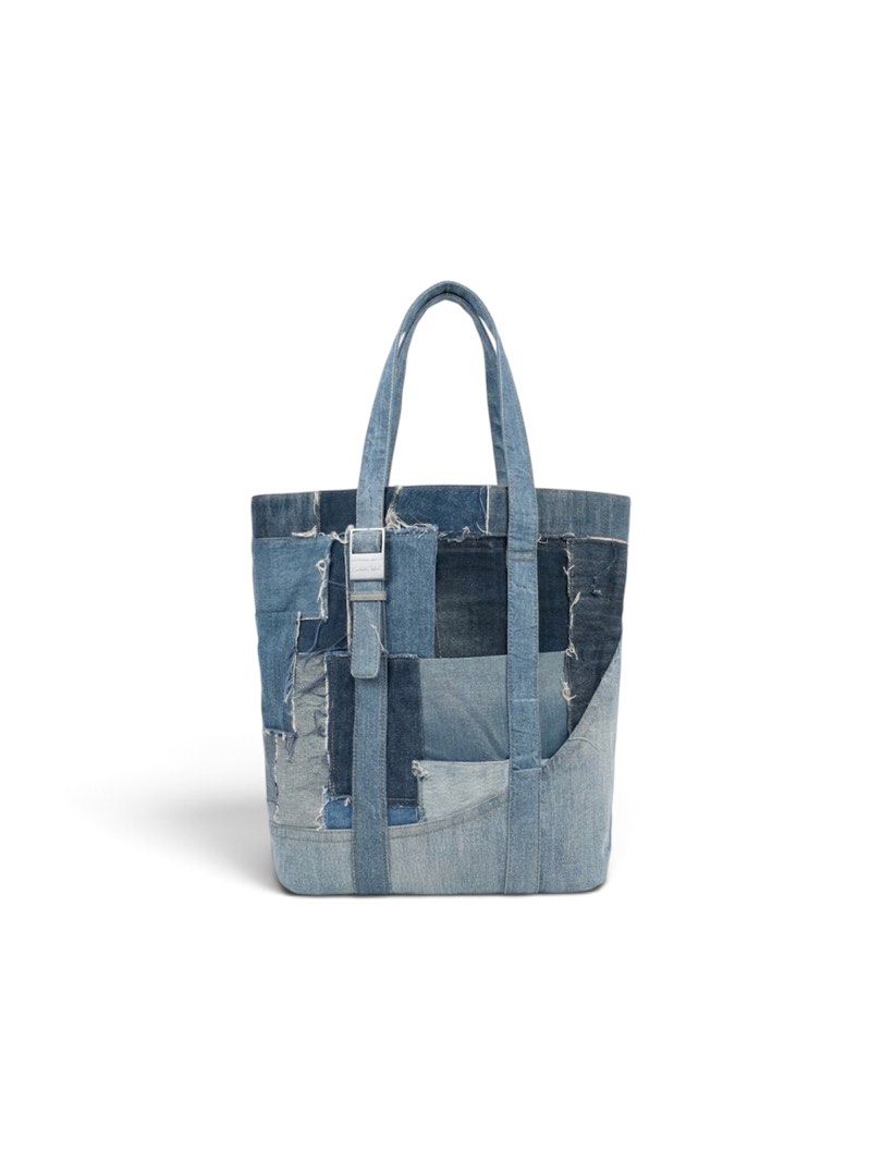 Emotional World Vintage Denim Patchwork Tote Bag (Category: Tote Bags) located in Lapu Lapu. Submitted by ukaydecebuofficial (Listing ID 1469792013, Image 1). Description: - Brand: Emotional World - Style: Denim patchwork tote bag with an upcycled look and frayed edges - Design: Varied wash shades with metallic buckle hardware on the front - Handles: Two sturdy top handles - Interior: Deep blue lining with brand patch logo - Storage: Convenient z