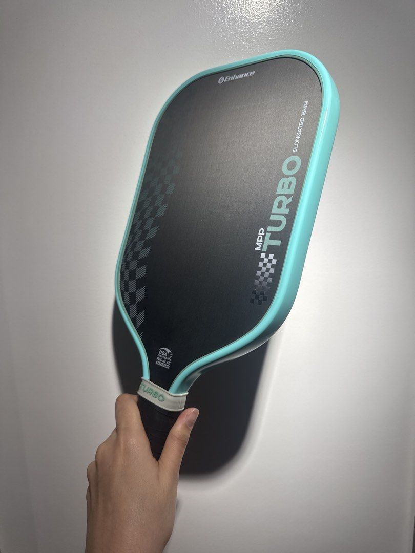 ENHANCE MPP TURBO 16MM (Category: Racket and Ball Sports) located in Manila. Submitted by ceeloved_ (Listing ID 1469816303, Image 2). Description: For sale‼️ Enhance MPP Turbo Elongated 16mm. Bought last July 2026 from the US. Grip taped and edge guarded since day 1. Lady owned. Used seldom. Extra paddle. Minimal ball marks on the paddle. No any other issues. Great paddle for beginners. With paddle cover. Selling it for only Php 4,500.00 Can do m