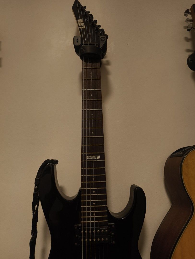 ESP LTD M-17 7-String Electric Guitar Black (Category: Musical Instruments) located in Rizal. Submitted by norkizz92 (Listing ID 1469860365, Image 2). Description: - Model: ESP LTD M-17 7-String Electric Guitar - Finish: Gloss Black with matching black hardware - Pickups: Dual humbucking pickups for a powerful tone - Bridge: Fixed bridge setup for solid tuning stability - Neck & Fretboard: Standard 7-string neck with M-17 inlay at the 12th fret -