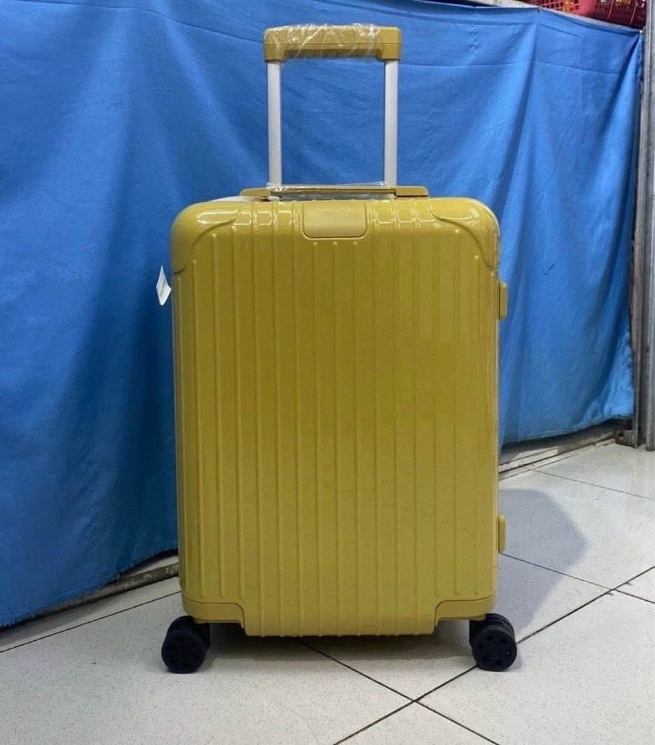 Essential Cabin 22 Luggage Multiple Colors Available (Category: Luggage) located in Manila. Submitted by dh3nz1 (Listing ID 1469788181, Image 3). Description: - Authentic Rimowa polycarbonate suitcase with iconic grooved shell - Features a smooth multi-wheel system and adjustable telescopic handle - Includes top and side carry handles with factory plastic wrap still attached - Clean and spacious interior setup for easy packing - Available vibrant