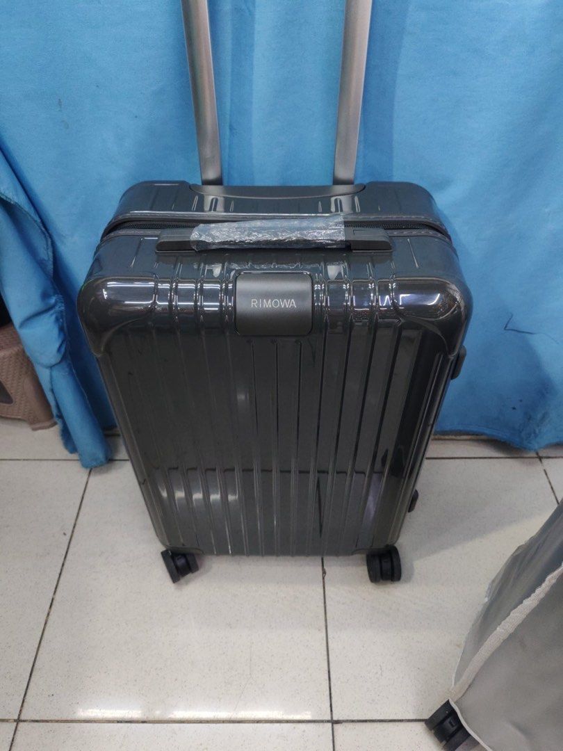Essential Cabin 22 Luggage Multiple Colors Available (Category: Luggage) located in Manila. Submitted by dh3nz1 (Listing ID 1469788181, Image 1). Description: - Authentic Rimowa polycarbonate suitcase with iconic grooved shell - Features a smooth multi-wheel system and adjustable telescopic handle - Includes top and side carry handles with factory plastic wrap still attached - Clean and spacious interior setup for easy packing - Available vibrant