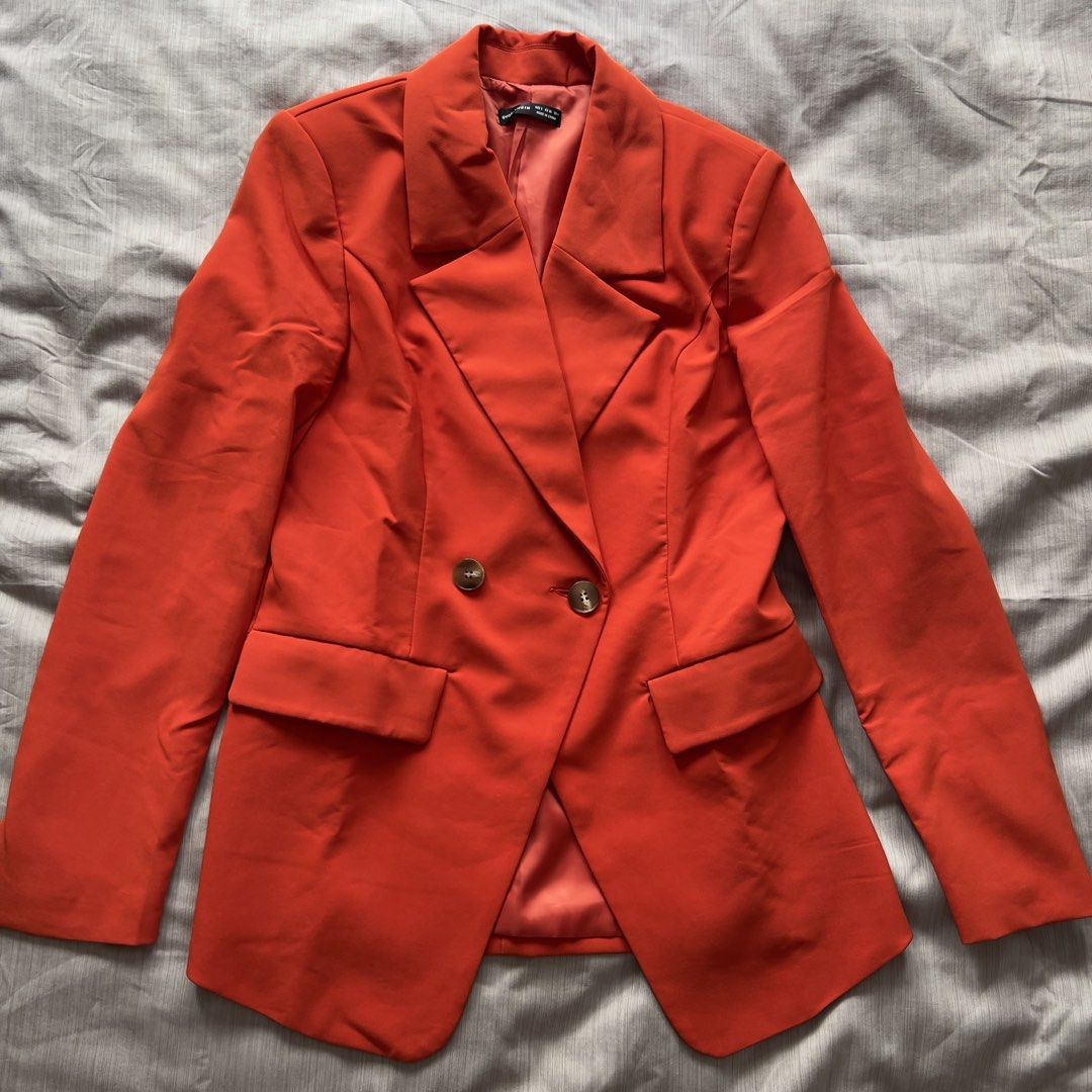 Evolushein Orange Double-Breasted Blazer Size S (Category: Coats, Jackets and Outerwear) located in Pasig City. Submitted by jenscloset86 (Listing ID 1469803401, Image 1). Description: Brand: SHEIN (Evolushein) Size: SMALL Color: Bright Orange/ Red Orange • BRAND NEW (but washed once). • Never used, never worn. • No flaws, no damages. Measurement: Shoulder: 16” Bust: 36” Length: 29.5” Sleeve: 26”.