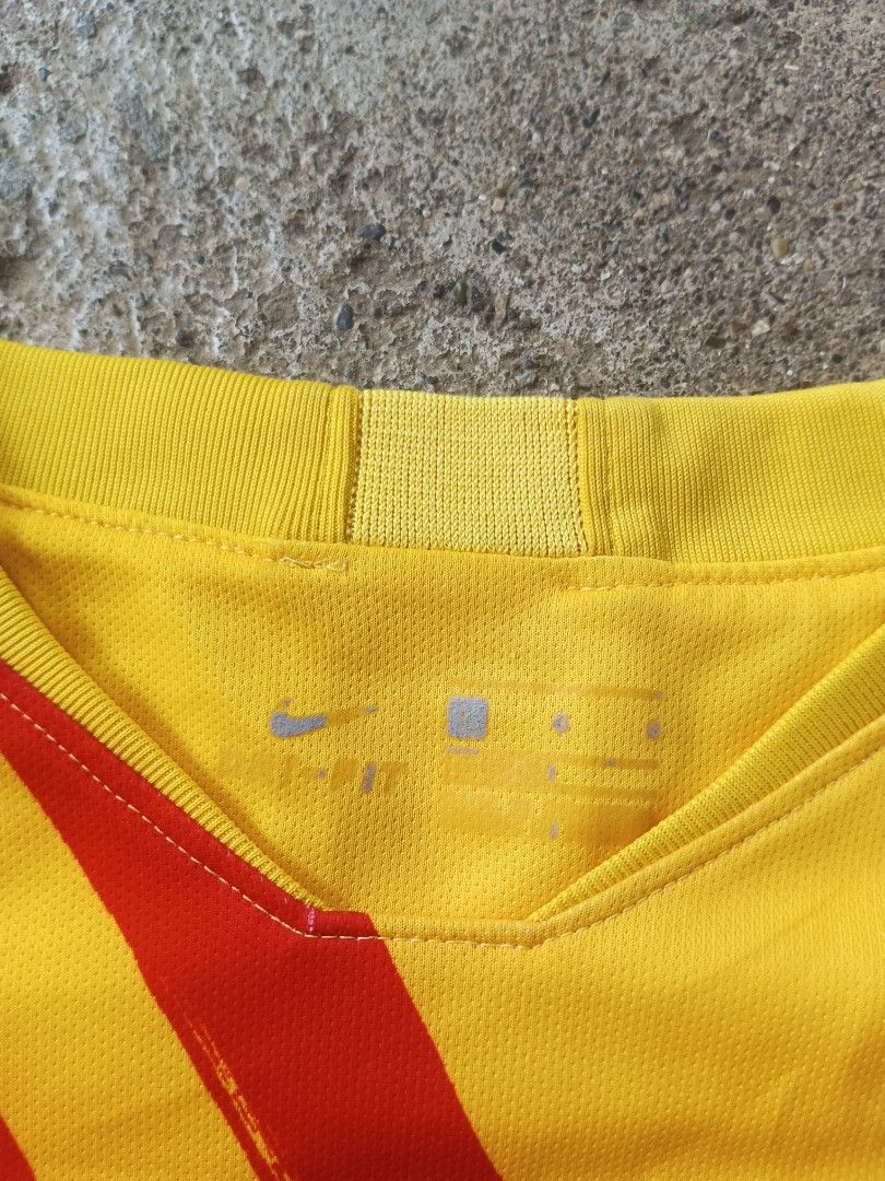 FC Barcelona 2019/20 Away Jersey Size L (Category: Activewear) located in Manila. Submitted by anjo1 (Listing ID 1469804474, Image 3). Description: - Item: FC Barcelona 2019/20 Away Jersey - Size: Large - Material: Nike Dri-FIT fabric - Design: Bright yellow base with red diagonal stripes - Sponsors: Rakuten (chest), Unicef (lower back), Beka (sleeve).