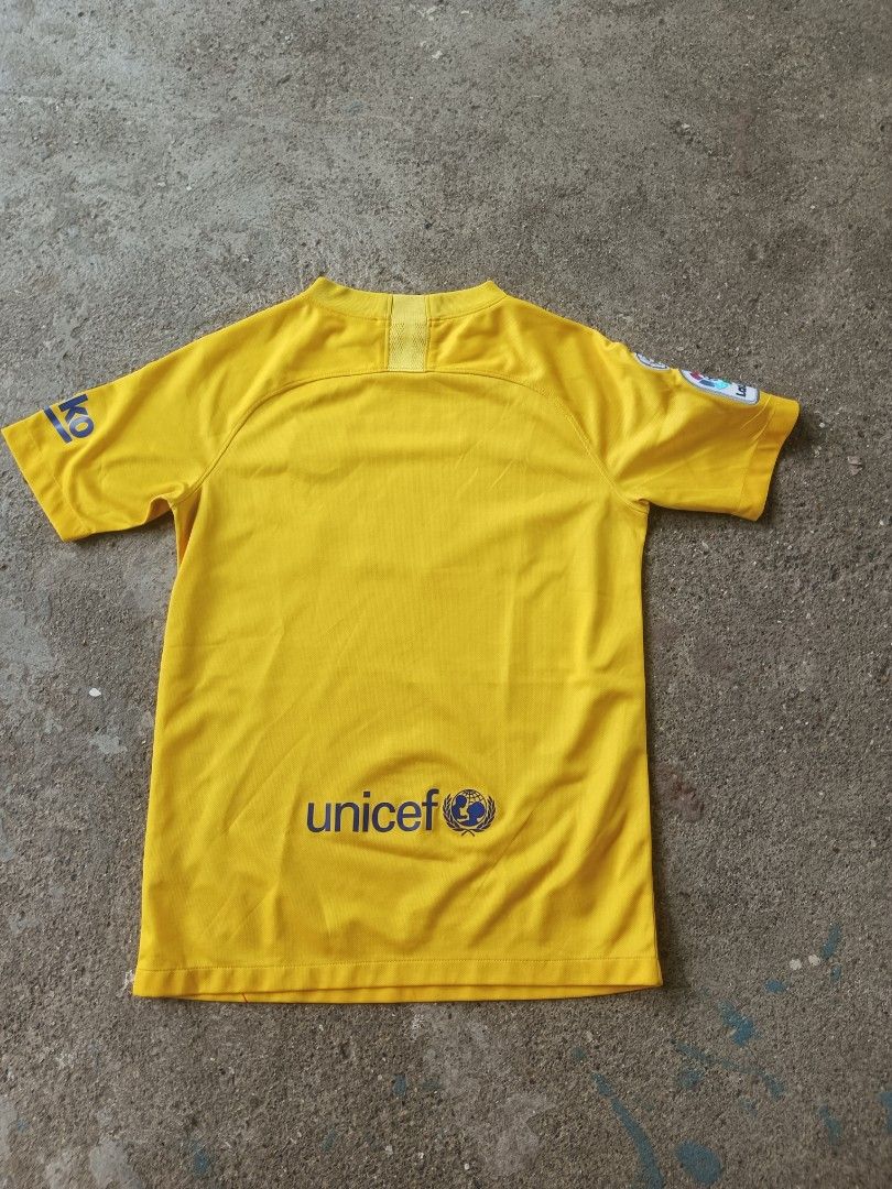 FC Barcelona 2019/20 Away Jersey Size L (Category: Activewear) located in Manila. Submitted by anjo1 (Listing ID 1469804474, Image 2). Description: - Item: FC Barcelona 2019/20 Away Jersey - Size: Large - Material: Nike Dri-FIT fabric - Design: Bright yellow base with red diagonal stripes - Sponsors: Rakuten (chest), Unicef (lower back), Beka (sleeve).