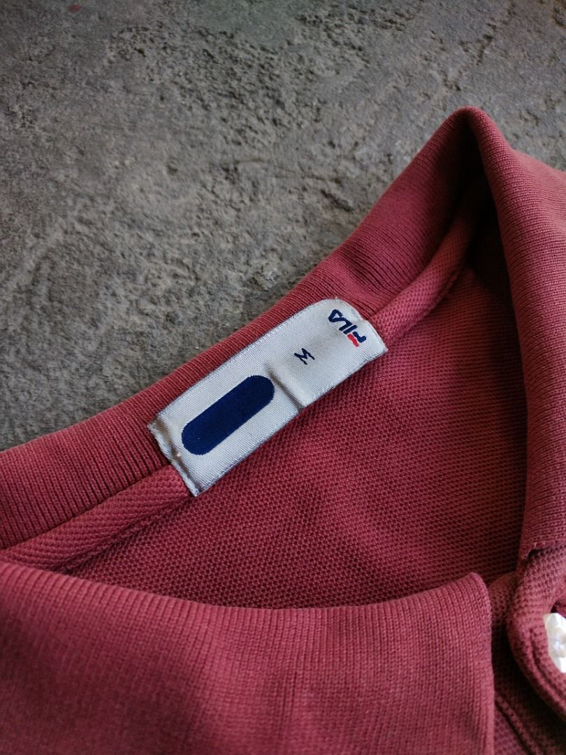 Fila Red Polo Shirt (Category: Tshirts & Polo Shirts ) located in Cavite. Submitted by benta.ni.jm (Listing ID 1469887067, Image 2). Description: Size: M Dimensions: 22.5 x 26.5 Condition: 9/10 Color Rate: 9/10 Issue: 📩📩📩.