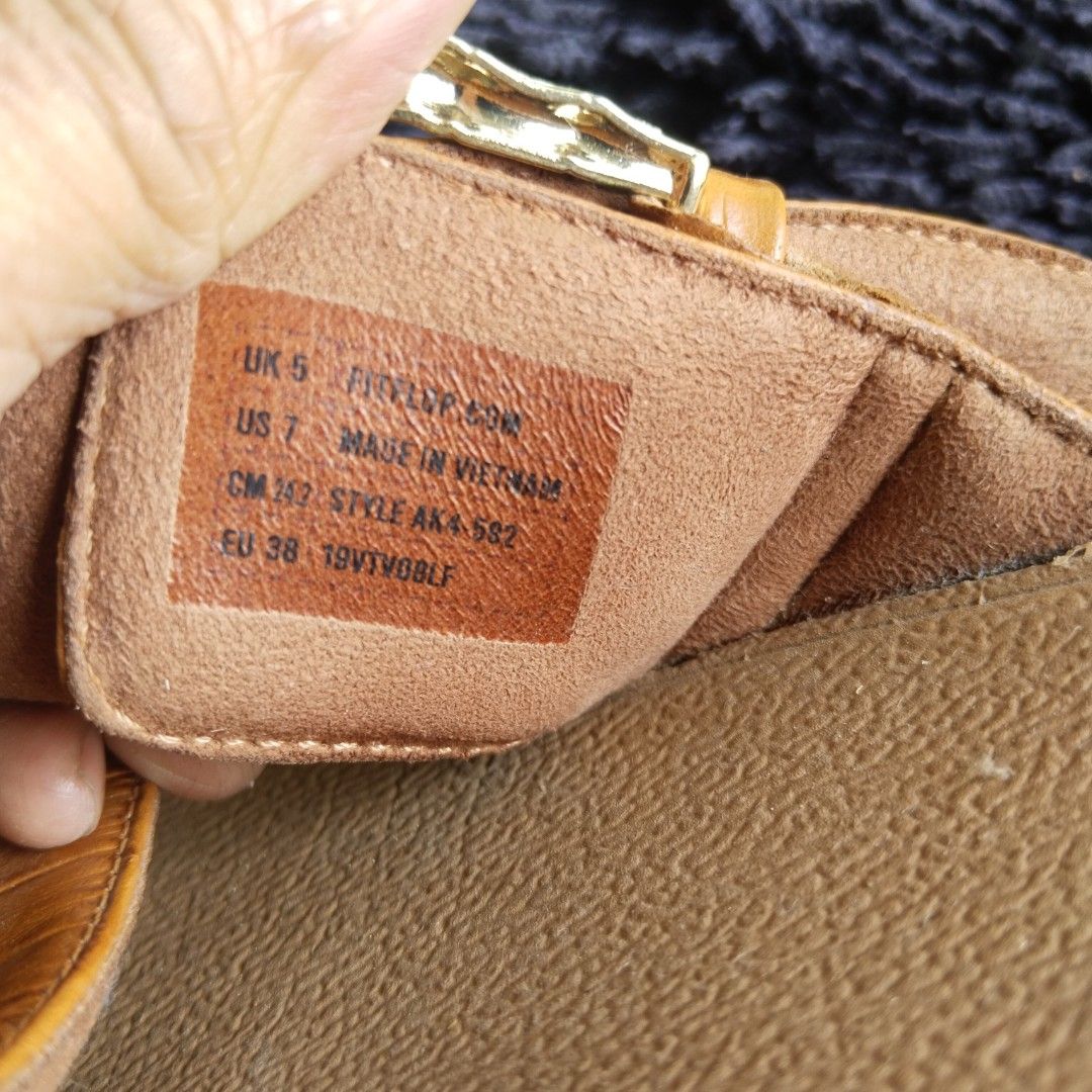 FitFlop Brown Crocodile Embossed Cross Strap Sandals (Category: Flats & Sandals) located in Lubao. Submitted by dione_closet503 (Listing ID 1469941841, Image 2). Description: - Brand: FitFlop - Color: Tan brown - Pattern: Crocodile embossed - Style: Easy slip-on slide sandals with cross straps - Details: Gold tone metal decorative buckles - Comfort: Cushioned footbeds for all-day support - Perfect for: Warm weather and everyday casual wear.