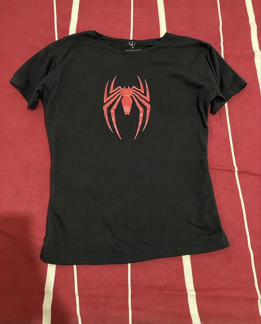 Fitted Spider-Man Graphic Black T-Shirt (Category: Shirts) located in Manila. Submitted by alysaysyys_ (Listing ID 1469829303, Image 1). Description: - Color: Black - Design: Iconic red Spider-Man symbol on front - Fit: Classic crew neck and fitted cut - Material: Lightweight, breathable cotton - Style: Great for superhero fans and casual everyday outfits - Condition: Excellent / Ready to ship.