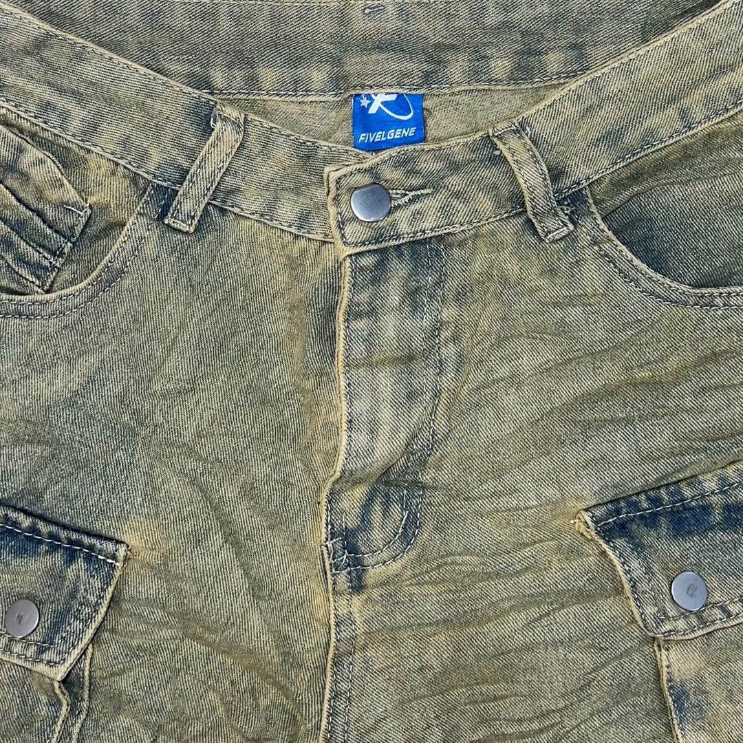 Fivelgene Olive Washed Distressed Cargo Pants (Category: Jeans) located in Davao. Submitted by brigulferic (Listing ID 1469872978, Image 2). Description: - Brand/Model: Fivelgene cargo pants - Color/Wash: Olive washed denim with a unique acid wash finish - Fit: Wide leg style with a high waist, belt loops, and zip fly - Details: Multiple utility pockets featuring button and zipper accents - Condition/Design: Distressed shredded knee patches with 
