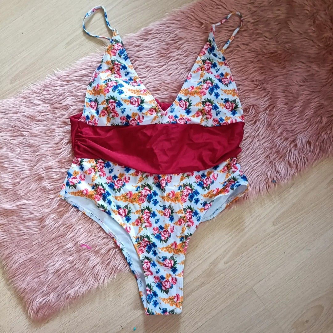 Floral Self tie One Piece (Category: Bikinis & Swimsuits) located in Bacoor. Submitted by Miss_Chuch0521 (Listing ID 1469809835, Image 1). Description: - Brand: Shein - Style: Floral Self-tie One Piece swimsuit - Size: XL (EU 42 / UK 14 / US 10) - Design: Elegant floral pattern with a bold magenta contrast waistband and plunging V-neck - Condition: Excellent, ready for the beach - Meetup Location: The One Dasma Place, Dasmariñas, Cavite.