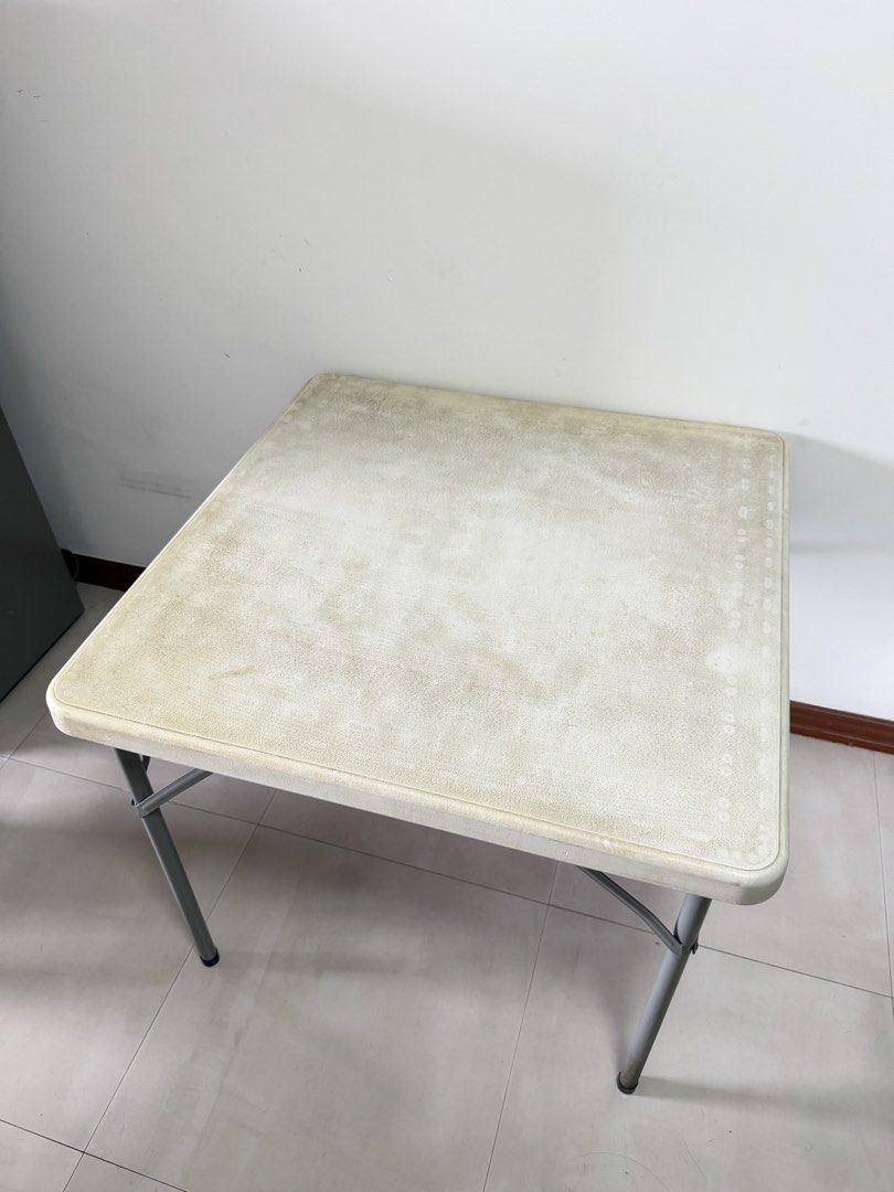 Foldable Square Dining Table + 6 Monobloc Chairs (Category: Tables & Sets) located in Las Pinas. Submitted by bea_laraya (Listing ID 1469860556, Image 2). Description: Foldable Dining Table Set – Table + 6 White Monobloc Chairs Inclusions: * 1 square folding table with cream/ivory tabletop and metal legs * 6 white plastic monobloc chairs * Ikea Table Cloth Table Dimensions: * Length: Approx. 85 cm (33.5 inches) * Width: Approx. 85 cm (33.5 inches