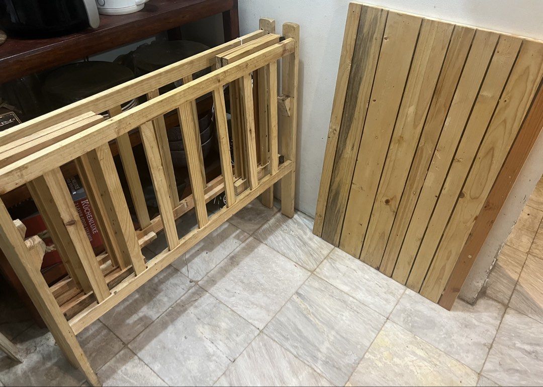 Foldable Wooden Baby Crib Nursery Bed (Category: Cots & Cribs) located in Quezon City. Submitted by jp.summer (Listing ID 1469877413, Image 2). Description: - Solid wooden baby crib with a classic natural finish - Features a secure slat design all around with an included slatted base panel - Conveniently folds flat for easy storage when not in use - Issue: there was a chip off sa gilid ng crib when we bought this but failed to return it as this w