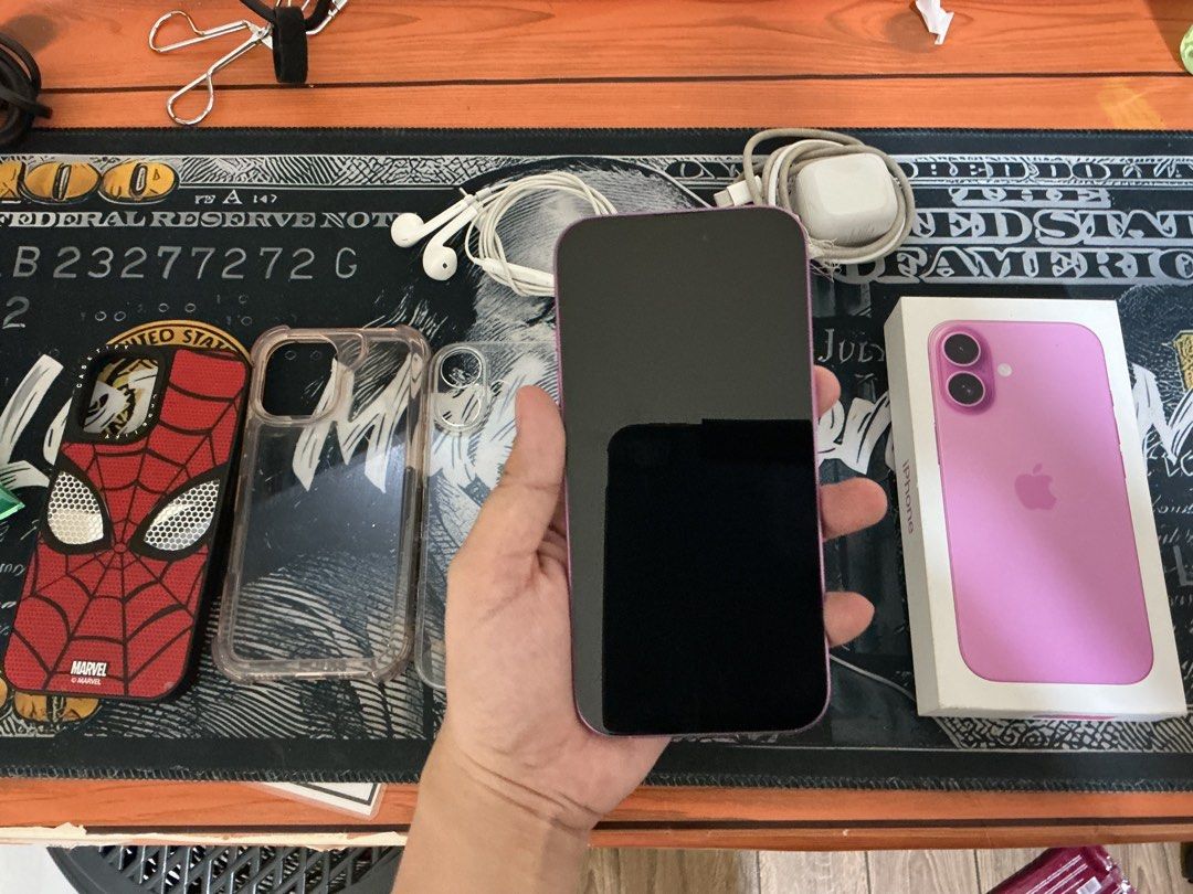 For Sale iPhone 16 (Category: iPhone 16 Series) located in Malabon City. Submitted by kathleenkayeonofre (Listing ID 1469798145, Image 2). Description: - Model: iPhone 16 - Storage: 128GB - Color: Pink - Condition: Excellent (Layered condition 7) - Inclusions: Original box, charger, wired earphones, and 3 phone cases (including a Marvel Spider-Man case) -Small dents still makinis -Slightly Negotiable -Battery Health 89% Can do meet ups RFS: Plan 
