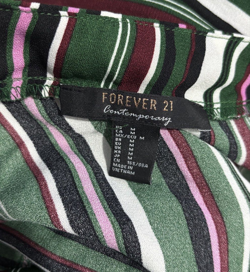 Forever 21 Green Striped Wrap Crop Top (Category: Blouses) located in Santa Cruz. Submitted by zellethrifts (Listing ID 1469927289, Image 3). Description: • Bought in Japan 🇯🇵 • Used once / Like new • Fits medium to large • In excellent condition • Photos taken using mannequin only 🚚 Shipping via J&T only 📦 Shipping fee to be shouldered by buyer 💳 Mode of payment: GCash 📍 Santa Cruz, Laguna.
