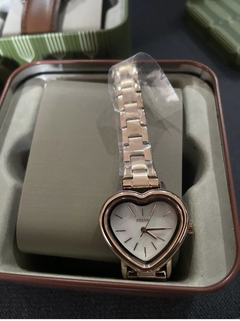 Fossil Heart Shaped Gold Tone Watch (Category: Women's Watches) located in Rizal. Submitted by gannda (Listing ID 1469786308, Image 2). Description: - Brand: Fossil - Condition: Brand new and unworn with original protective plastic film still on the strap - Design: Cute heart-shaped face with a stunning mother of pearl dial and minimalist hands/markers - Material: Elegant rose and yellow gold-tone metal link bracelet strap with a secure clasp - I