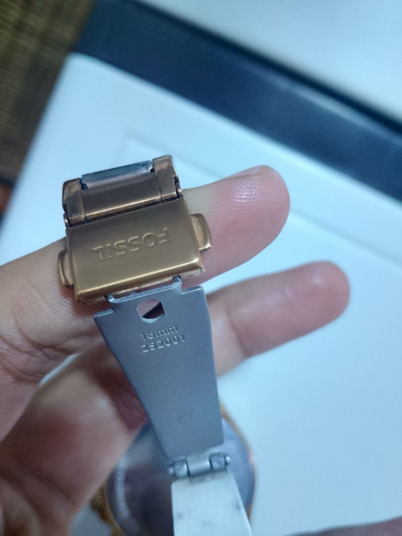 Fossil Rose Gold Chronograph Watch (Category: Women's Watches) located in Real. Submitted by marcomarjo53691 (Listing ID 1469882123, Image 3). Description: - Brand: Fossil - Color: Elegant Rose Gold - Display: Chronograph with 3 sub-dials - Numerals: Classic Roman numerals at 12 and 6 o'clock - Band: Stainless steel link bracelet with secure deployant clasp (16mm sizing) - Model Details: Stamped 252001 on case back and clasp - Condition: Well-mai