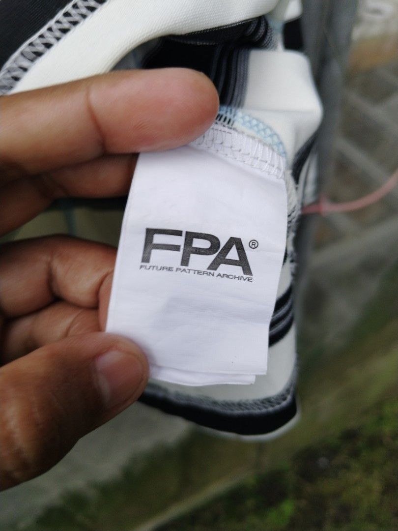 FPA Future Pattern Archive fpa Long Sleeve (Category: Tshirts & Polo Shirts ) located in Legazpi City. Submitted by genobecollectives (Listing ID 1469769380, Image 3). Description: - Brand: FPA Future Pattern Archive - Style: Long sleeve tee with black and white stripes - Size: XL (Relaxed fit) - Details: Contrast blue stitching and small embroidered logo on chest - Material: Heavyweight cotton feel - Condition: Clean, with neck and wash tags int