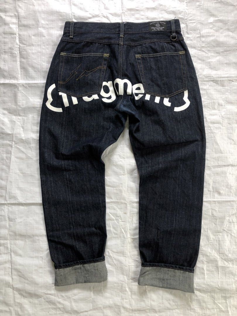Fragment Design Jeans and GU Active Shirt Bundle (Category: Tshirts & Polo Shirts ) located in Manila. Submitted by tunicy2k (Listing ID 1469784981, Image 1). Description: - Bundle includes: Dark denim jeans and black GU Active collared shirt (Size M) - Jeans feature bold white Fragment branding on the back and signature lightning bolt pocket embroidery - Shirt includes a convenient front pocket detail - Photos show actual items laid flat on a wh