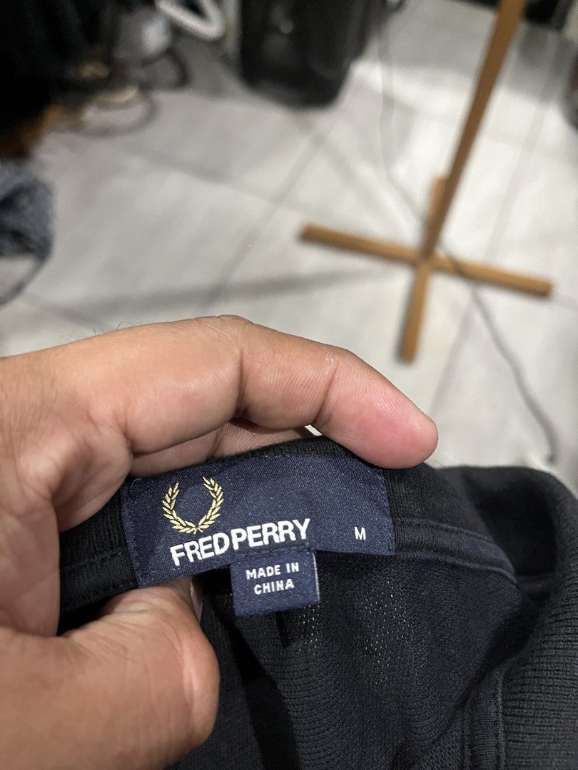 Fred Perry Polo Shirt /Black /Medium (Category: Luxury Apparel) located in Camalaniugan. Submitted by anarchymonopoly052128 (Listing ID 1469911016, Image 3). Description: Width: 21 Inches Length: 28 Inches Need Rewash nakadisplay sa shop.