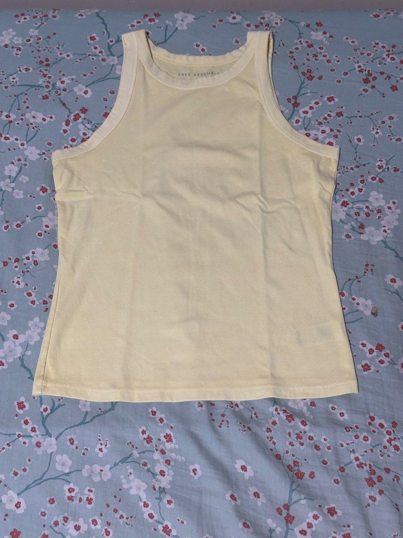 Free Assembly Yellow Ribbed Tank Top (Category: Sleeveless) located in Mandaluyong City. Submitted by gelatinxx (Listing ID 1469911253, Image 1). Description: - Brand: Free Assembly - Color: Bright Yellow - Style: Ribbed tank top with scoop neckline and thick binding straps - Fit: Regular fit with a straight hemline - Material: Soft and breathable cotton blend - Condition: New, never worn. Just removed tag and put in the washer - Perfect basic fo