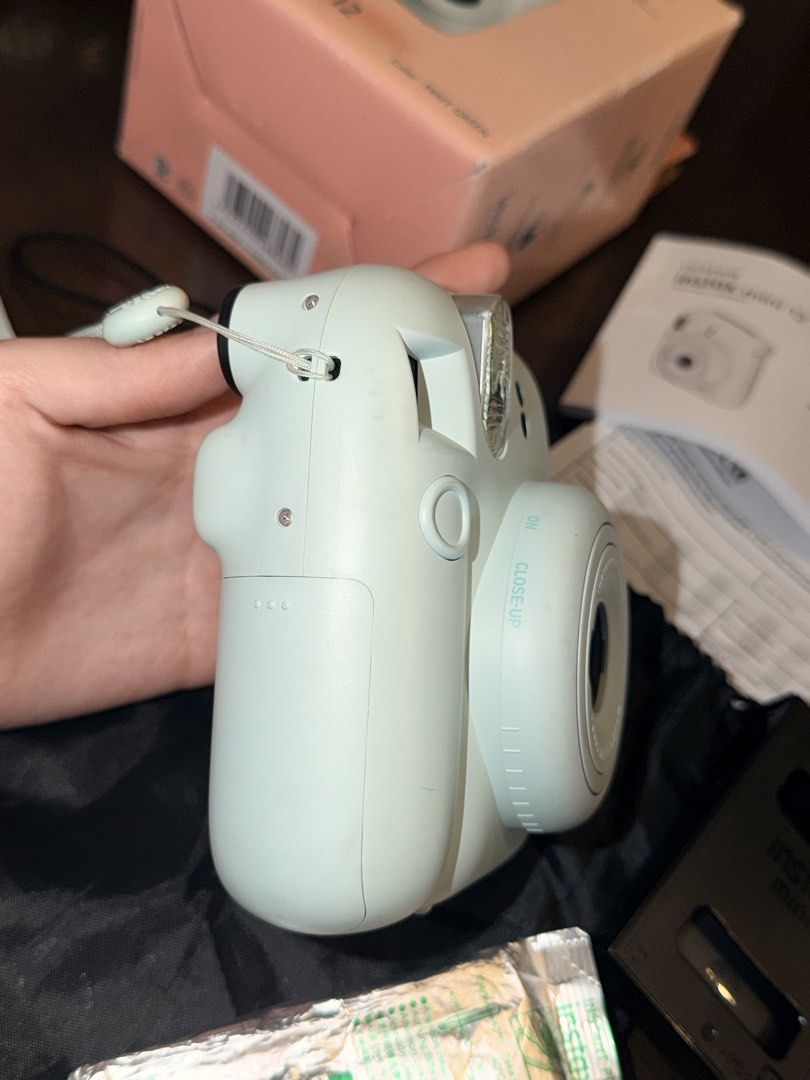 FUJIFILM INSTAX MINI 12 (Personal Preloved) (Category: Cameras) located in Olongapo. Submitted by tbhcollect88551 (Listing ID 1469826960, Image 3). Description: preloved instax mini 12 •₱4,000 •working condition, no operation issues •with free (1) unused film, (1) used with remaining film •with minimal dirt pero di naman masyadong halata •payment first •shipping: j&t / lalamove •loc: san fernando, pampanga.