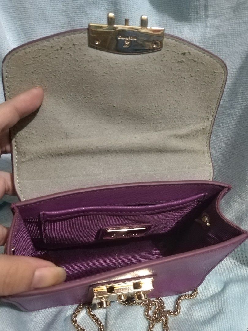 Furla Metropolis (Category: Cross-body Bags) located in Valenzuela. Submitted by nurzdara28 (Listing ID 1469788348, Image 2). Description: Furla Metropolis leather mini crossbody bag in purple with gold-tone hardware. Brand: Furla Model: Metropolis Mini Crossbody Material: Textured/pebbled leather Color: Purple / Violet / Lilac Hardware: Gold-tone push-lock closure Coded..