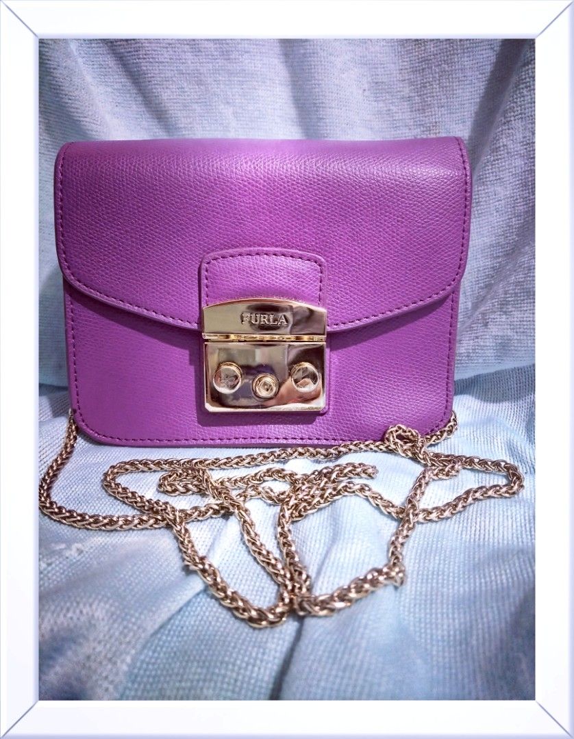 Furla Metropolis (Category: Cross-body Bags) located in Valenzuela. Submitted by nurzdara28 (Listing ID 1469788348, Image 1). Description: Furla Metropolis leather mini crossbody bag in purple with gold-tone hardware. Brand: Furla Model: Metropolis Mini Crossbody Material: Textured/pebbled leather Color: Purple / Violet / Lilac Hardware: Gold-tone push-lock closure Coded..