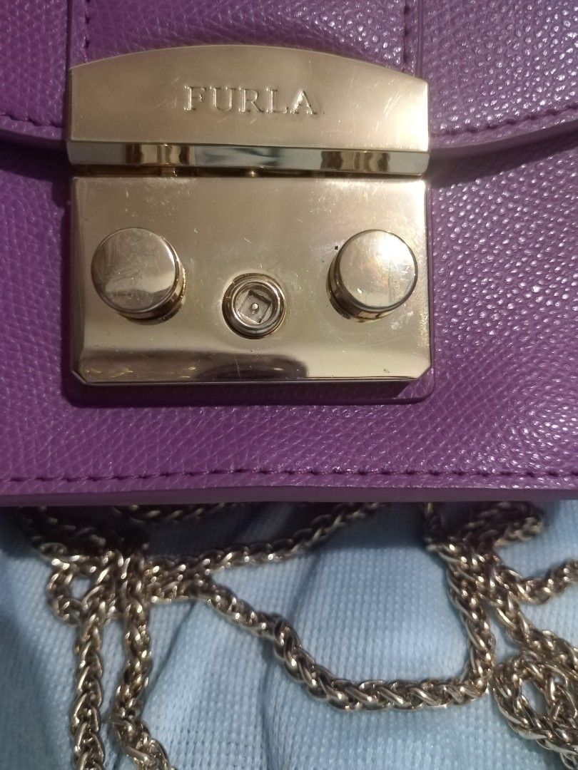 Furla Metropolis (Category: Cross-body Bags) located in Valenzuela. Submitted by nurzdara28 (Listing ID 1469788348, Image 3). Description: Furla Metropolis leather mini crossbody bag in purple with gold-tone hardware. Brand: Furla Model: Metropolis Mini Crossbody Material: Textured/pebbled leather Color: Purple / Violet / Lilac Hardware: Gold-tone push-lock closure Coded..