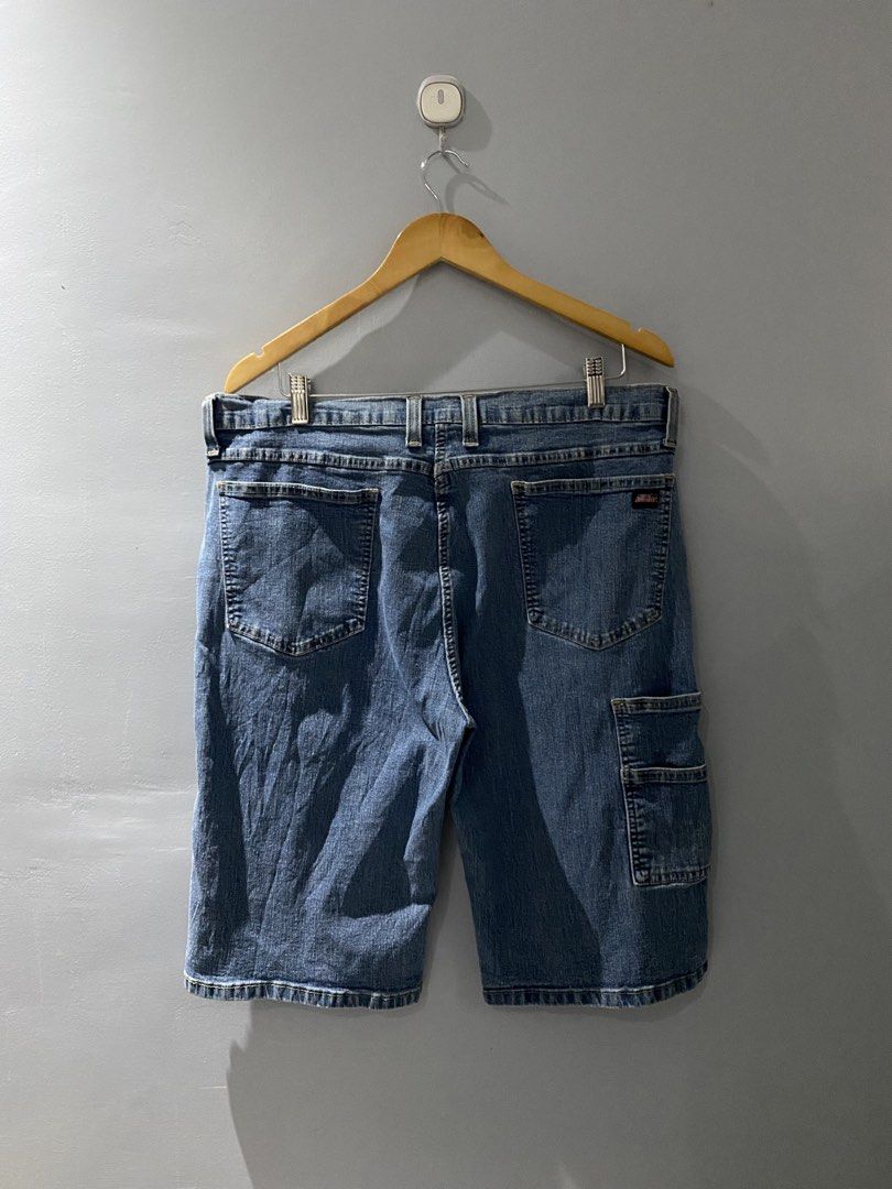 Genuine Dickies Denim Cargo Shorts Size 38 (Category: Shorts) located in Bangued. Submitted by koroysthrifts (Listing ID 1469885576, Image 2). Description: - Brand: Genuine Dickies 38x23.5x10.5 - Item: Denim cargo shorts - Color: Blue - Size: 38 waist - Material: 82% cotton, 16% polyester, 2% spandex blend for extra stretch - Features: Multiple utility pockets including side cargo pockets, button closure with zip fly - Origin: Made in Mexico - Co