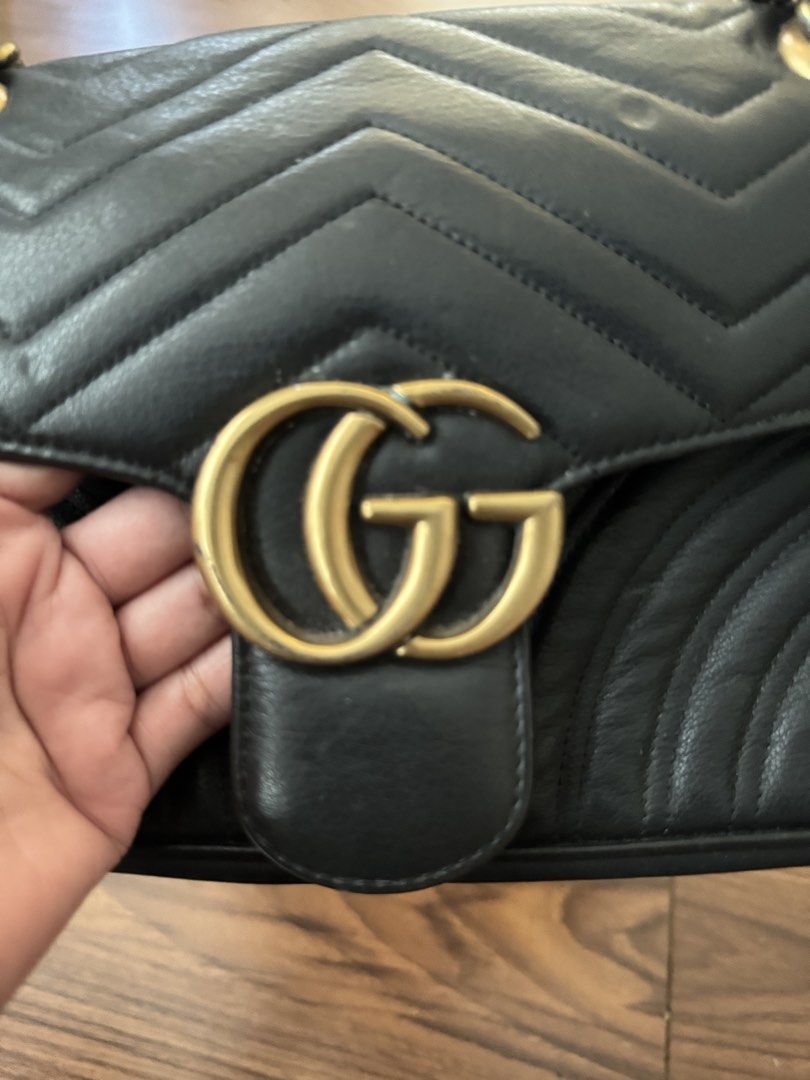 GG Marmont Matelasse Black (Category: Cross-body Bags) located in Rizal. Submitted by thrifty.mom (Listing ID 1469859393, Image 2). Description: - Brand: Gucci GG Marmont Shoulder Bag - Color: Classic Black - Material: Premium Leather with chevron quilting and back heart detail - Hardware: Antique brass with sliding chain strap and leather shoulder pad - Closure: Flap closure with iconic Interlocking G clasp Measurement 30cm Thrift find only No g
