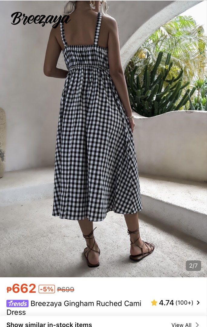 Gingham Cami Dress (Category: Dresses) located in Caloocan City. Submitted by everythingbagel67 (Listing ID 1469775400, Image 2). Description: - Brand: Breezaya - Pattern: Black and white gingham check - Design: Halter neckline with front cross straps and square back straps - Fit: Smocked elastic waist with a flowing A-line midi skirt - Material: Lightweight fabric, ideal for warm weather or beach trips - Condition: Clean condition.